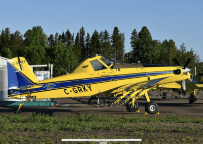 Yellow plane parked at airport